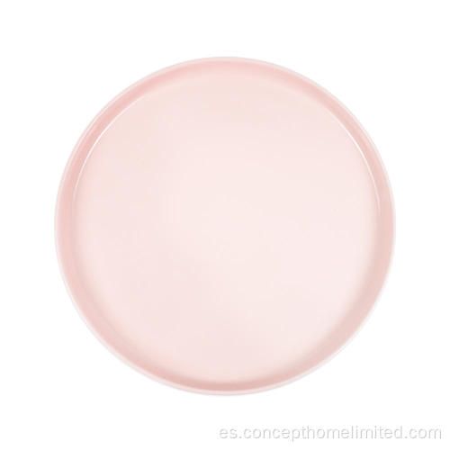 Cena reactiva de gres glaseada colocada en rosa